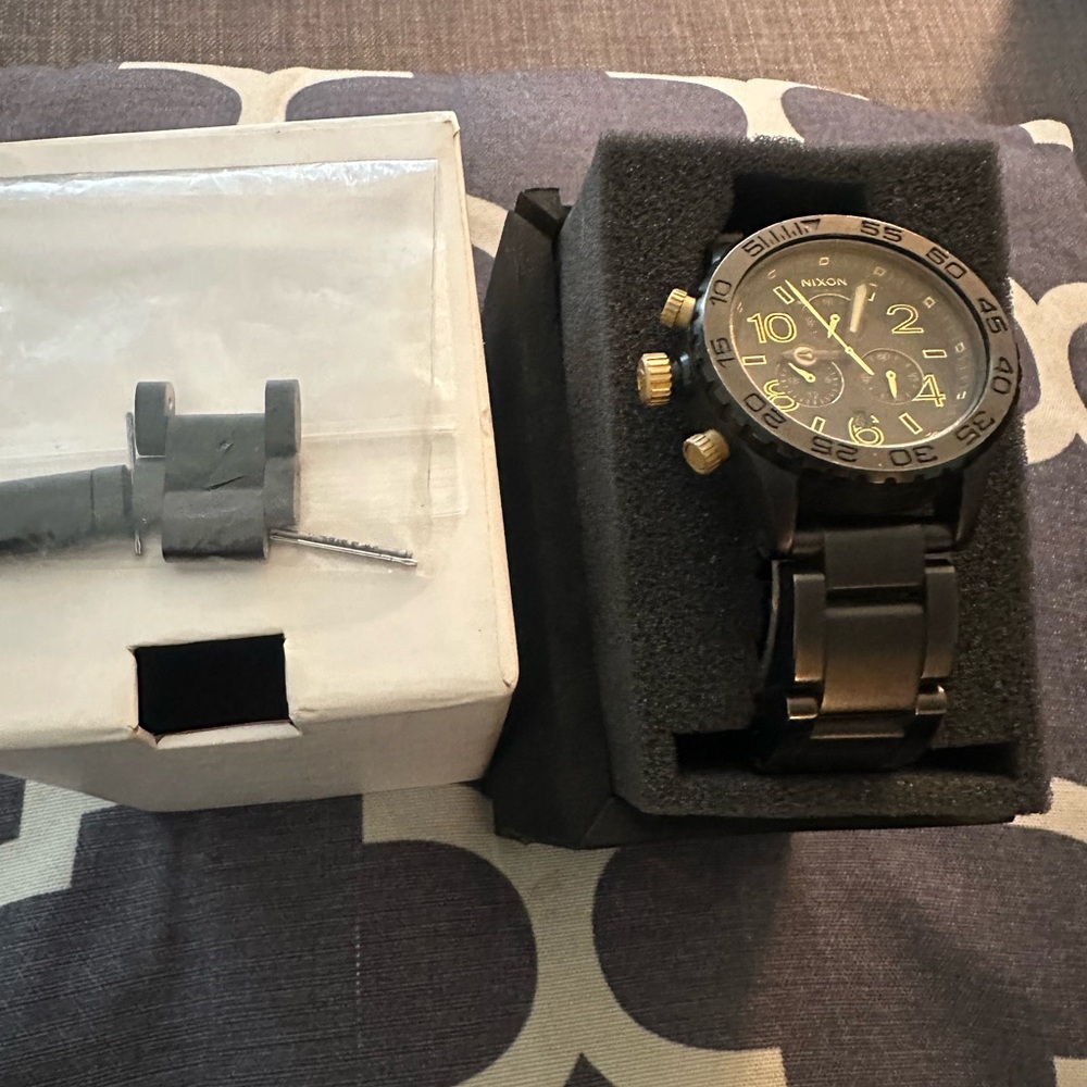 Nixon Black and Gold Watch